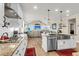 Bright, open kitchen boasts a breakfast bar, stainless appliances, and access to living area at 658 Yellow Leaf Ln, Summerville, SC 29486