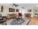 Cozy living room featuring comfortable seating, a stylish rug, and an adjacent game room at 658 Yellow Leaf Ln, Summerville, SC 29486
