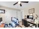 Well-lit office with natural light, ceiling fan, and a dedicated workspace at 658 Yellow Leaf Ln, Summerville, SC 29486