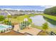 Community playground and pool area located near a scenic pond and wooded area at 658 Yellow Leaf Ln, Summerville, SC 29486