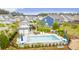 Aerial view of the community pool and lounging area with tables and chairs at 658 Yellow Leaf Ln, Summerville, SC 29486