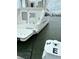 Boat stern with swim platform labeled Birmingham, AL and stainless grab rail at 67 W 10Th St # E-3, Folly Beach, SC 29439