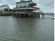 Unique waterfront home on stilts, featuring multiple decks for relaxing and enjoying the scenic views at 67 W 10Th St # E-3, Folly Beach, SC 29439