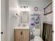 Bathroom featuring a vanity with light-wood cabinets, framed mirror, and shower with patterned curtain at 7955 Timbercreek Ln # 1807, North Charleston, SC 29418