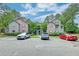 Apartment building with assigned parking spaces and a manicured landscape at 7955 Timbercreek Ln # 1807, North Charleston, SC 29418