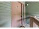 Charming condo front door with decorative sidelight and prominent unit letter 'G' at 7955 Timbercreek Ln # 1807, North Charleston, SC 29418