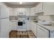 Bright kitchen with white cabinetry, modern appliances, and sleek countertops at 7955 Timbercreek Ln # 1807, North Charleston, SC 29418