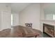 Inviting living room features wood-look flooring, fireplace, and plenty of natural light at 7955 Timbercreek Ln # 1807, North Charleston, SC 29418