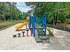 Community playground features two slides, stairs, and lily pads on a soft sandy base at 7955 Timbercreek Ln # 1807, North Charleston, SC 29418