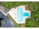 Aerial view of a community pool and amenities including lounge chairs and tables at 7955 Timbercreek Ln # 1807, North Charleston, SC 29418