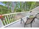 Scenic outdoor balcony with seating and a view of the well-manicured landscape at 8 Town Park Ln # C, Charleston, SC 29412