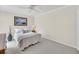 Neutral bedroom features a cozy bed, ceiling fan, and framed artwork at 8 Town Park Ln # C, Charleston, SC 29412