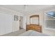 Bedroom featuring closet, dresser, and window that brings in natural light at 8 Town Park Ln # C, Charleston, SC 29412