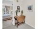 Hallway with a drop leaf table which leads to the bedroom with balcony access at 8 Town Park Ln # C, Charleston, SC 29412