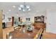 Open-concept dining and living area boasts hardwood floors and ample natural light, perfect for gatherings at 8 Town Park Ln # C, Charleston, SC 29412