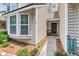 Close-up of home's entryway with neutral siding and door at 8 Town Park Ln # C, Charleston, SC 29412