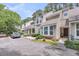 Well-maintained townhouse exterior with parking, landscaping, and a front entrance at 8 Town Park Ln # C, Charleston, SC 29412