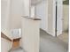 Upstairs hallway with carpet, closet, and a view of the entry and staircase at 8 Town Park Ln # C, Charleston, SC 29412