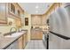 Bright kitchen featuring stainless steel appliances, light wood cabinetry, and ample counter space at 8 Town Park Ln # C, Charleston, SC 29412