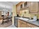 Functional kitchen area with light wood cabinets and modern appliances and sight lines into other living spaces at 8 Town Park Ln # C, Charleston, SC 29412