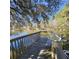Picturesque view of Hollis Lake from a wooden pier and bench, ideal for relaxation and recreation at 8 Town Park Ln # C, Charleston, SC 29412