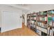 Spacious living room with hardwood floors, large bookshelf and adjacent closet for ample storage at 8 Town Park Ln # C, Charleston, SC 29412