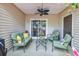 Inviting covered patio area with comfortable seating, perfect for relaxing and entertaining outdoors at 8 Town Park Ln # C, Charleston, SC 29412