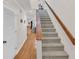 Carpeted staircase leading to the upper level, providing access to other rooms in the home at 8 Town Park Ln # C, Charleston, SC 29412