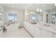 Serene bathroom featuring a soaking tub, marble floors and dual sinks with large vanity at 80 On The Harbor Dr, Mount Pleasant, SC 29464