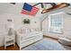 Cozy bedroom featuring a daybed, window seat, and charming nautical decor at 80 On The Harbor Dr, Mount Pleasant, SC 29464