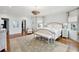 Spacious bedroom with white furnishings, hardwood floors, and large windows at 80 On The Harbor Dr, Mount Pleasant, SC 29464