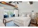 Bedroom with shiplap walls, wood beams, window seat, built-in cabinet, and modern decor at 80 On The Harbor Dr, Mount Pleasant, SC 29464
