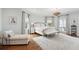 Bright bedroom with a chandelier, hardwood floors, and natural light from multiple windows at 80 On The Harbor Dr, Mount Pleasant, SC 29464