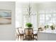 Charming breakfast nook with bay windows offering scenic views and elegant chandelier lighting at 80 On The Harbor Dr, Mount Pleasant, SC 29464