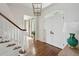 Light-filled foyer featuring hardwood floors, white trim, and elegant lighting at 80 On The Harbor Dr, Mount Pleasant, SC 29464