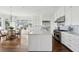 Spacious kitchen with stainless steel appliances and a large island, adjacent to the sunlit breakfast area at 80 On The Harbor Dr, Mount Pleasant, SC 29464