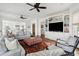 Open-concept living room with built-in shelving, an ottoman, and a comfortable sectional at 80 On The Harbor Dr, Mount Pleasant, SC 29464