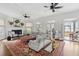 Bright and airy living room with white shiplap walls and water views at 80 On The Harbor Dr, Mount Pleasant, SC 29464