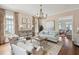 Open-concept living room with hardwood floors and light-colored furniture at 80 On The Harbor Dr, Mount Pleasant, SC 29464