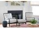 Cozy living room featuring a fireplace, stylish seating, and a patterned rug at 80 On The Harbor Dr, Mount Pleasant, SC 29464