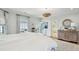 Main bedroom with ensuite bathroom, hardwood floors and access to private balcony at 80 On The Harbor Dr, Mount Pleasant, SC 29464