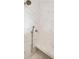 Shower with marble tiles, shower bench, and handheld shower head at 80 On The Harbor Dr, Mount Pleasant, SC 29464