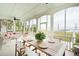 Inviting screened-in porch features waterfront views and a dining area perfect for entertaining at 80 On The Harbor Dr, Mount Pleasant, SC 29464
