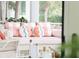Comfortable sunroom seating with fish pillows offers a relaxing space at 80 On The Harbor Dr, Mount Pleasant, SC 29464