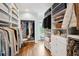 Spacious walk-in closet with custom shelving, drawers, and ample hanging space for clothing and accessories at 80 On The Harbor Dr, Mount Pleasant, SC 29464