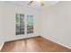 Inviting bedroom features hardwood floors and large windows, making this a relaxing space to retreat to at 8451 Walsham St, North Charleston, SC 29420