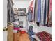 Walk-in closet with ample storage solutions including shelves, rods and drawers, ready to organize your wardrobe at 8451 Walsham St, North Charleston, SC 29420