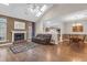 Bright living area with fireplace, skylights, and open floor plan connecting to kitchen and dining spaces at 8451 Walsham St, North Charleston, SC 29420