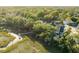 Stunning aerial view showcasing the property's waterfront location and private dock at 853 Whispering Marsh Dr, Charleston, SC 29412