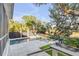 Serene backyard with a pool, stone patio, palms, and beautiful natural surroundings, perfect for relaxation at 853 Whispering Marsh Dr, Charleston, SC 29412